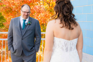 Bride and dad at first look in wedding dress