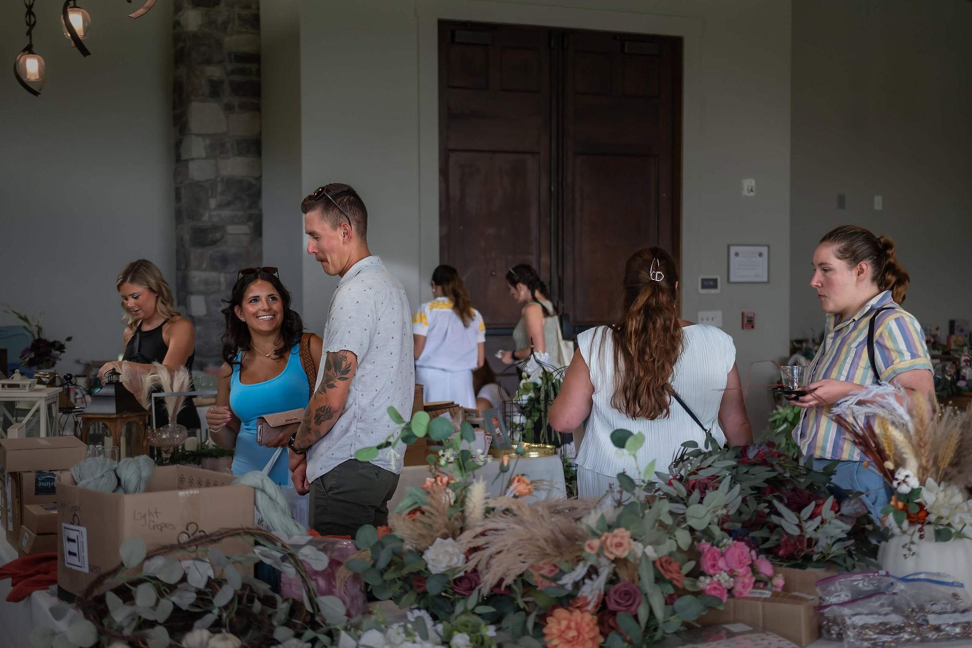 shoppers at the carolina premiere resale market browsing wedding goods