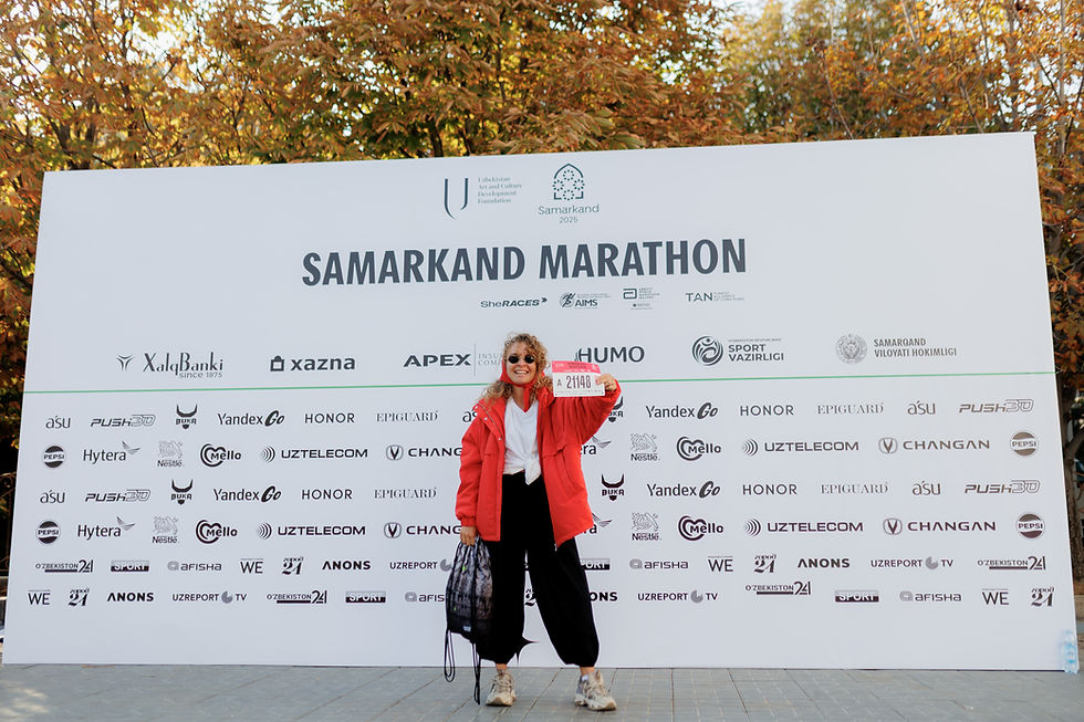 A woman holding up her race number at the Samarkand Marathon