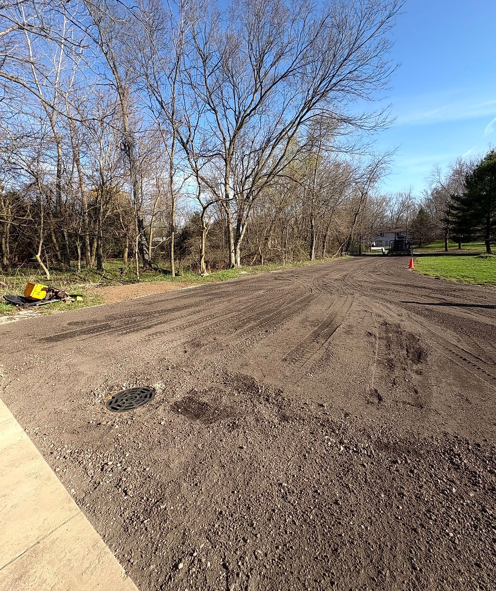 After driveway graded and manhole installed