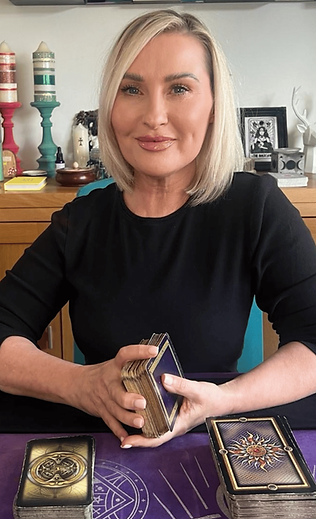 Cheryl Kerr holding a deck of tarot cards