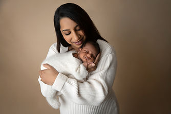smiling newborn and mum
