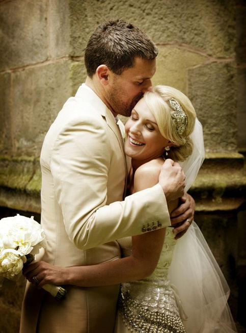 Emotional Bride and Groom embracing just after their wedding ceremony in Surrey.