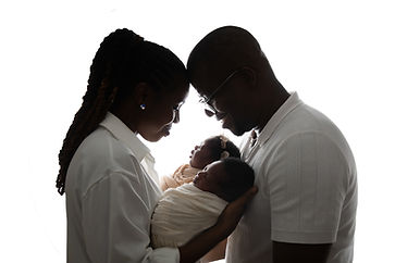 parents holding their newborn twins