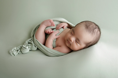 newborn boy in green