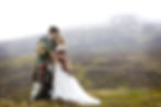 Romantic highland portraits across the hills and through the woods, with the bride hiking in boots and blanket, the groom in full tartan, and their dog never far behind.