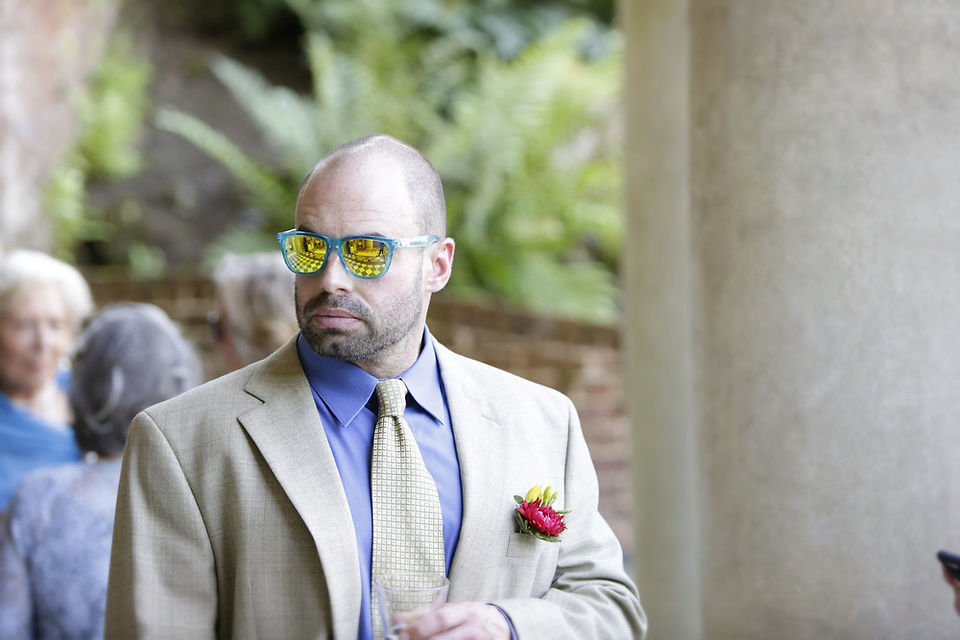 black and white tiles reflected in wedding guest's glasses at Wotton House 