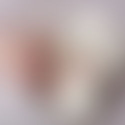 smiling newborn during an in-home newborn photography session