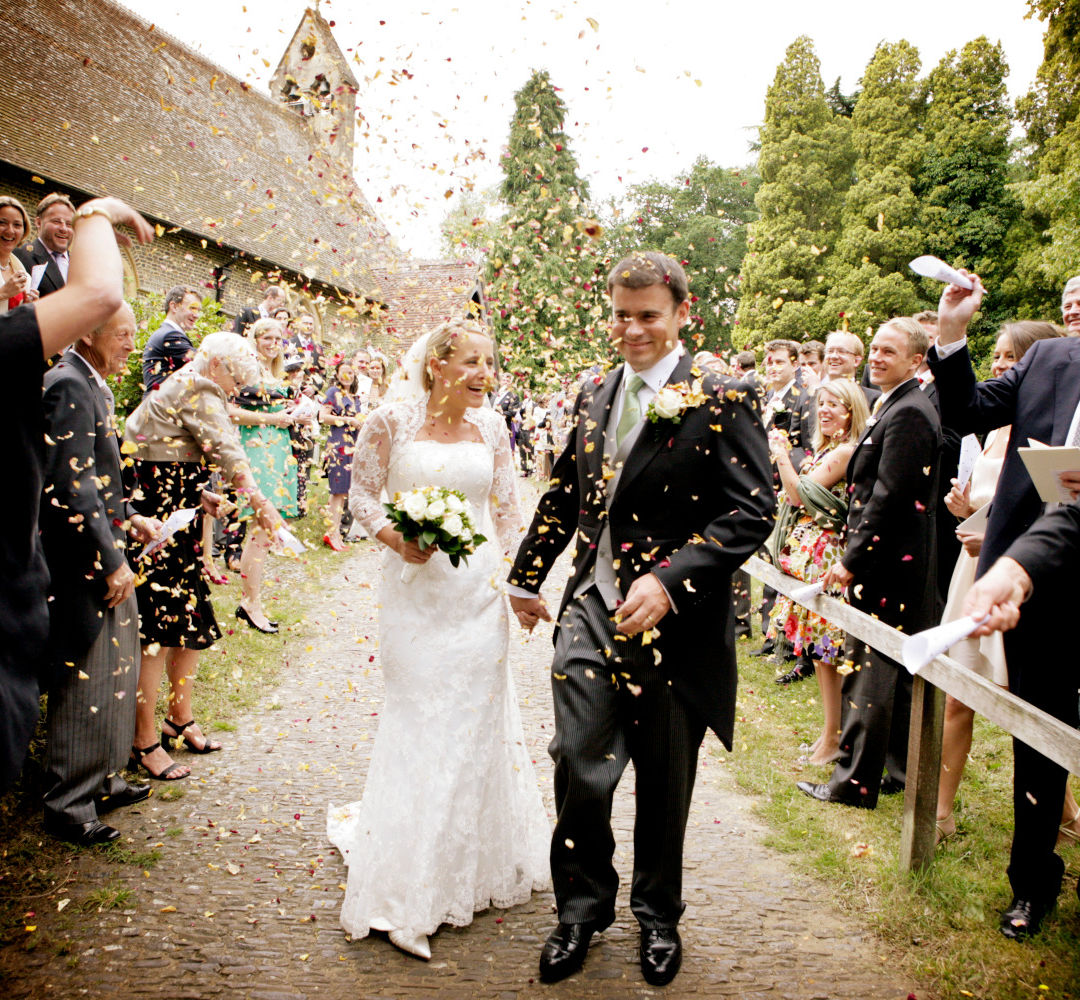 couple walking through confetti cloud