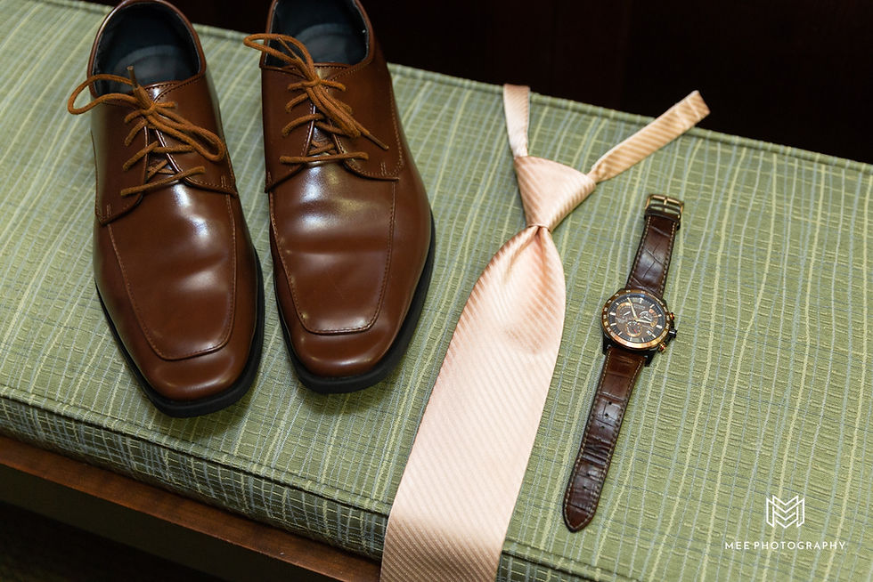 Groom's wedding details with brown shoes and blush tie