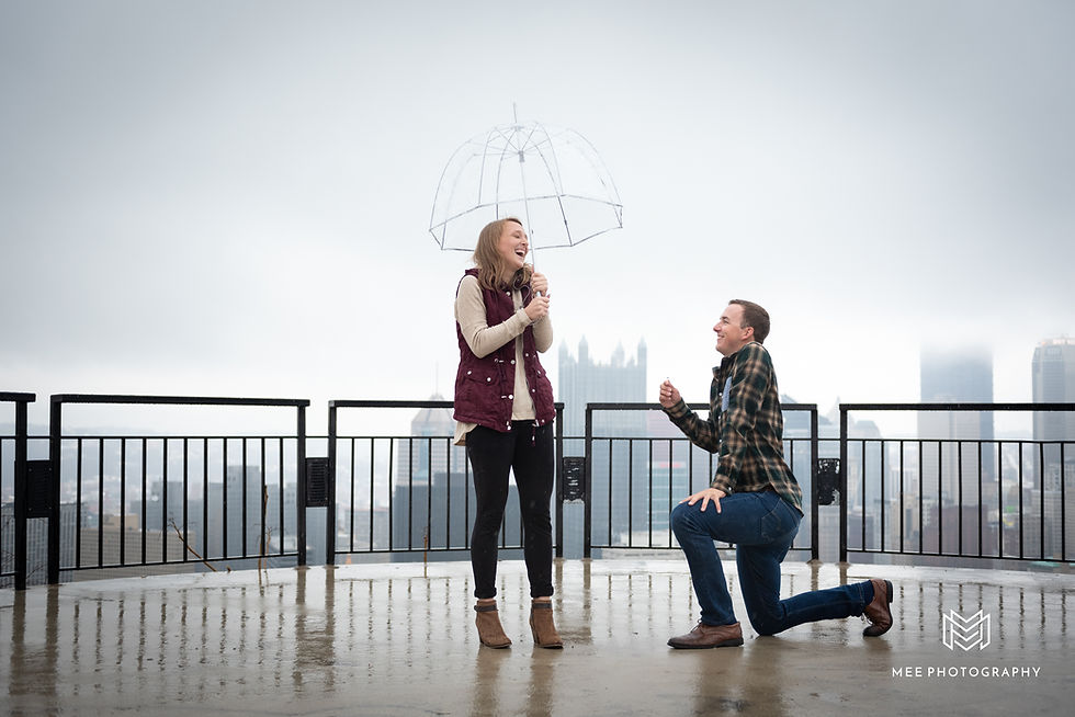 Surprise proposal on the Mount Washington Overlook in the rain