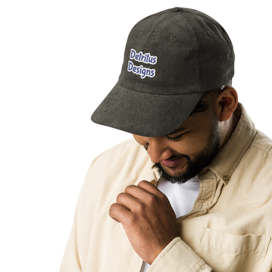black embroidered corduroy cap with adjustable strap on male model
