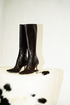 Content creation shoot at ZINCTT Studios. Vintage leather boots on a cow hide stool.