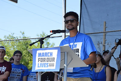 Maxwell at the March For Our Lives, speaking.