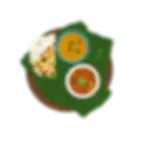 Indian meal on banana leaf with rotis, dal, and spicy curry, served on a wooden plate.