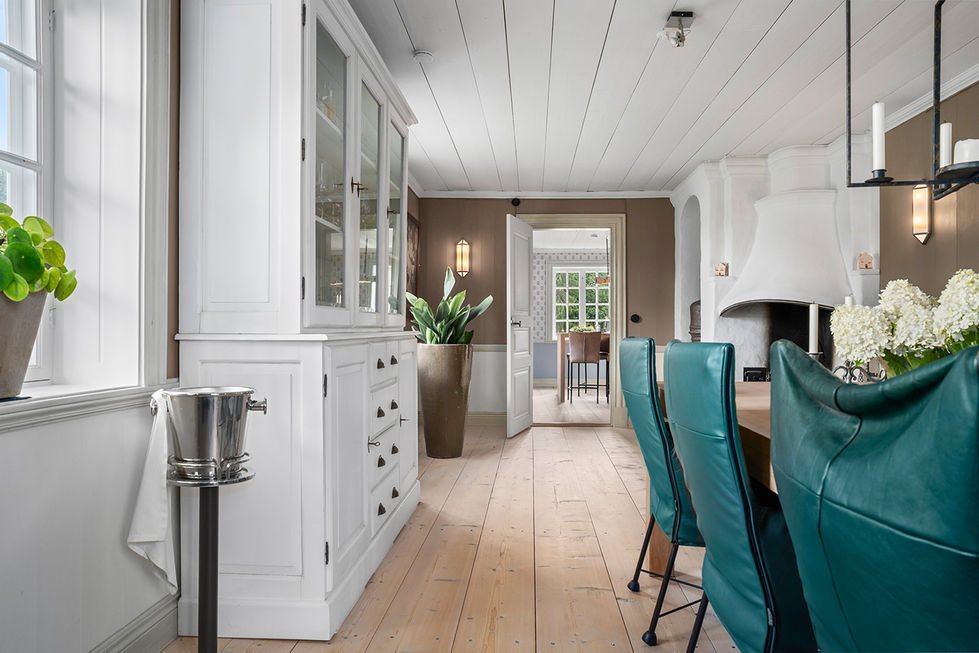 Dining room of the Mårbacka house with fireplace and natural light