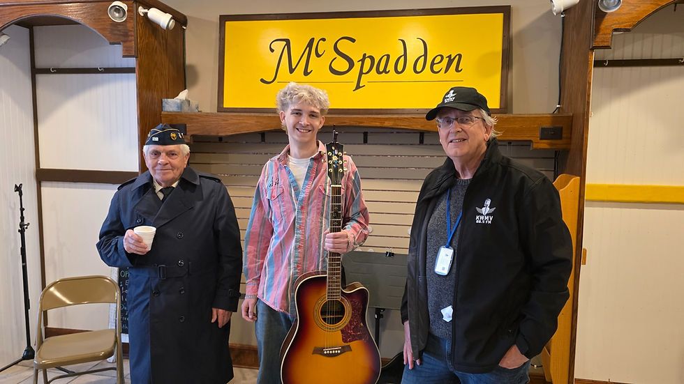 Musicians and radio guests inside the McSpadden studio setting in Mountain View, Arkansas.