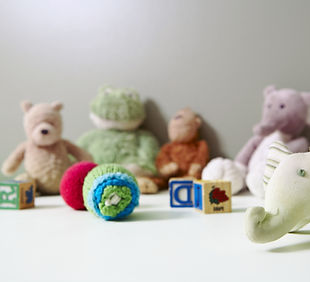 Child-friendly therapy room at AMK Counseling with plush toys and play materials for expressive play.