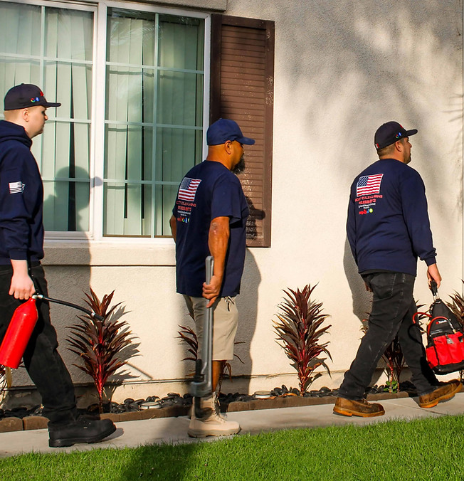 Plumbers walking into a house for a plumbing job_edited.jpg