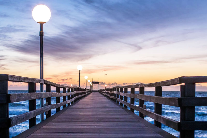 Peaceful pier reflecting calm waters symbolizing healing and mental wellness at Natalie Atwell Counseling in Concord NC