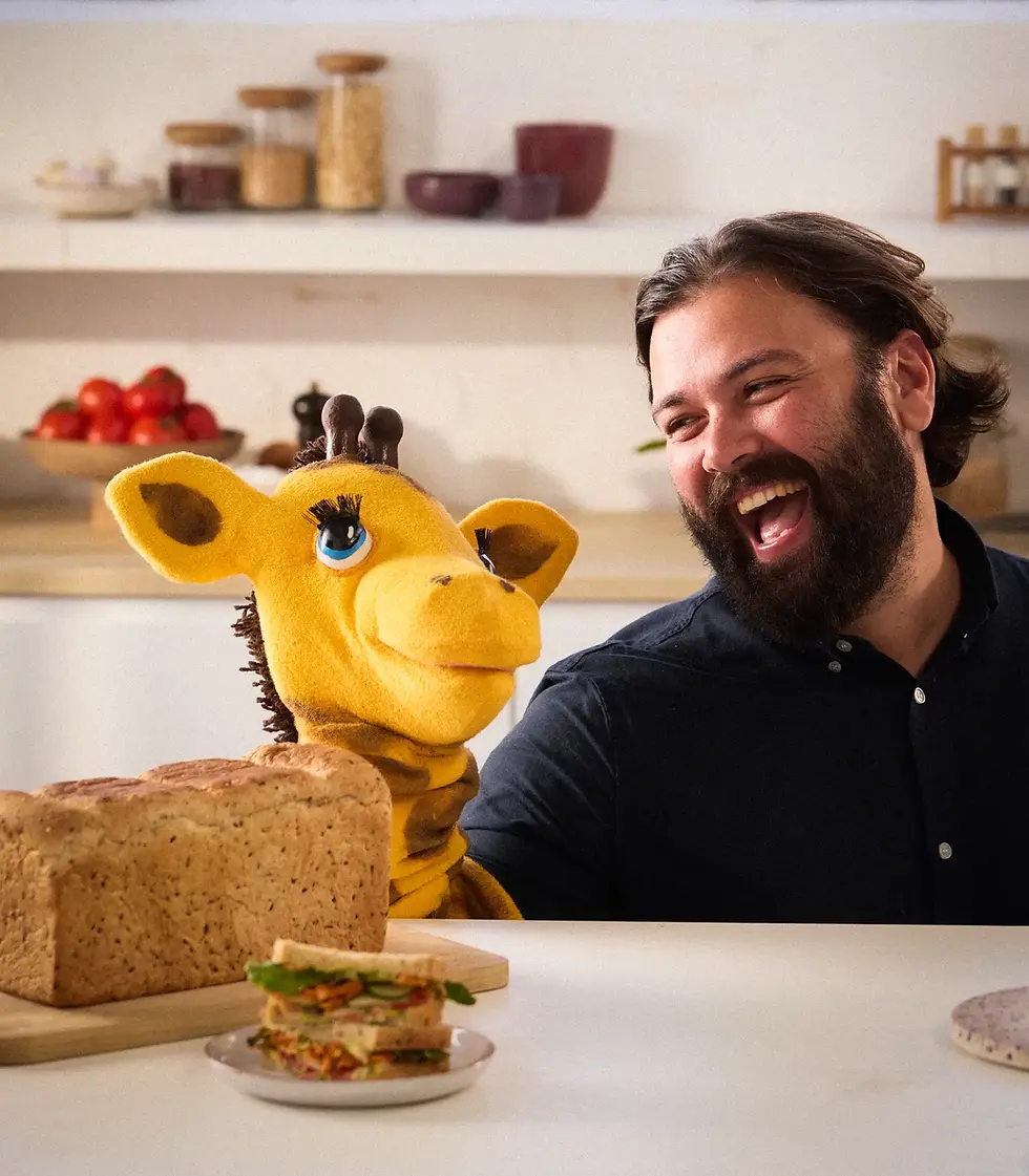 Eli and a giraffe for web.webp