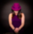 Diane Arthurs a.k.a DISAX standing with saxophone, wearing a purple hat