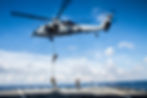 MAAC Holdings CEO Adam Lowers descending rope from helicopter to ship