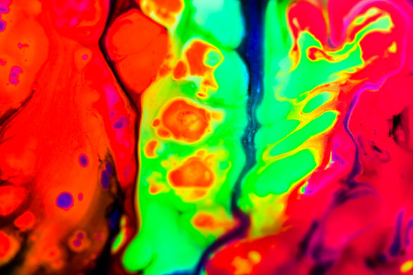 Experimental paint abstract neon colour imagery under UV.
