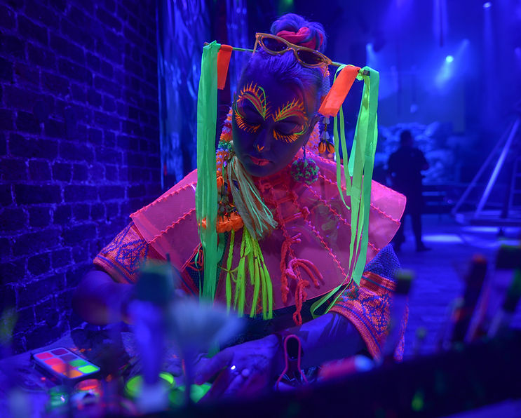 Jylle Navarro face painting in neon.