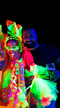 Neon Belly dancers at a glow party.