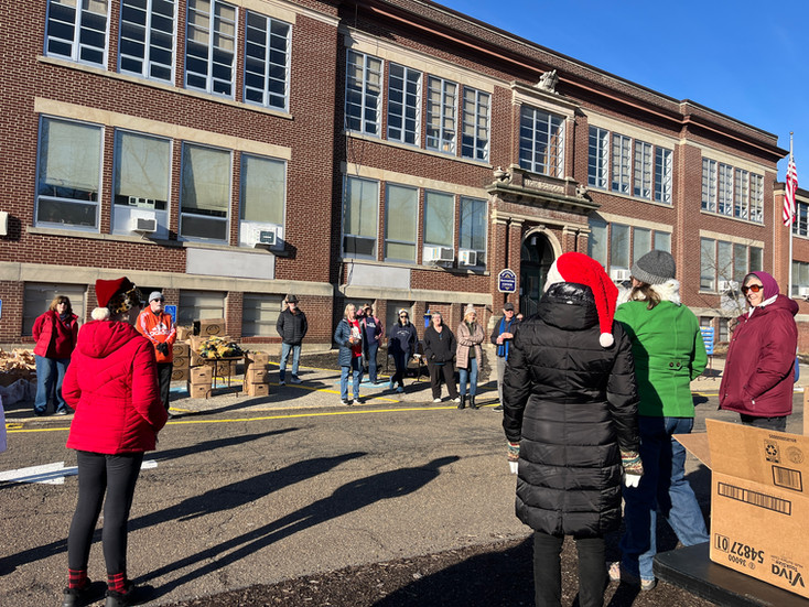 volunteers gather to distribute food