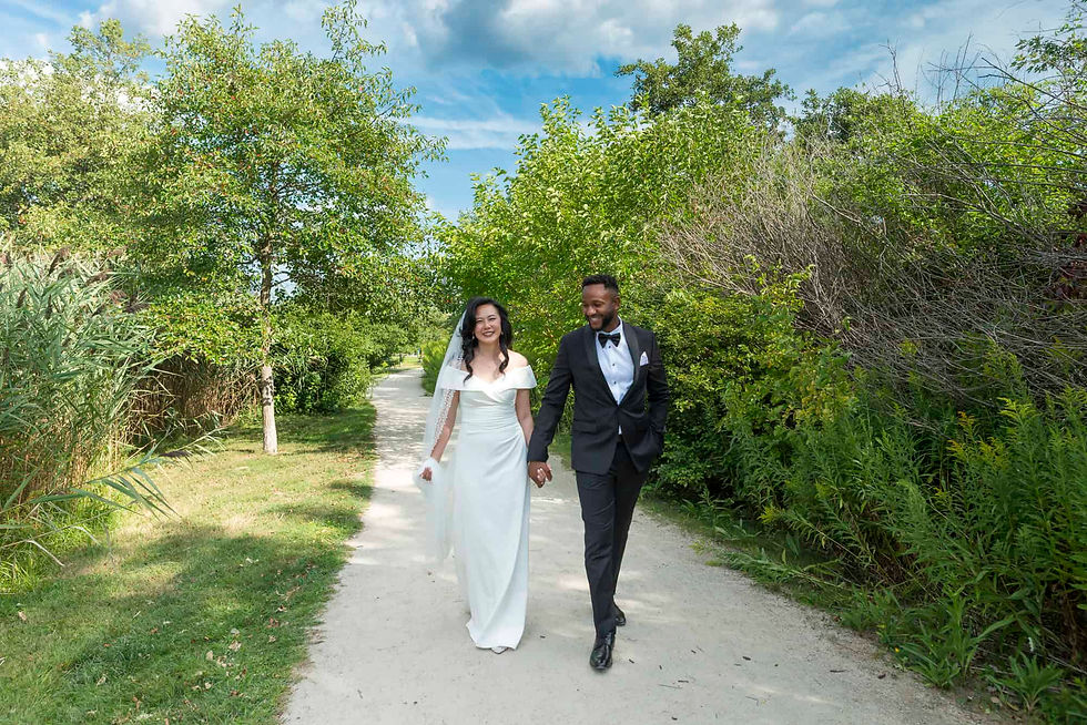 engaged-couple-walking-along-a-tree-lined-path.jpg
