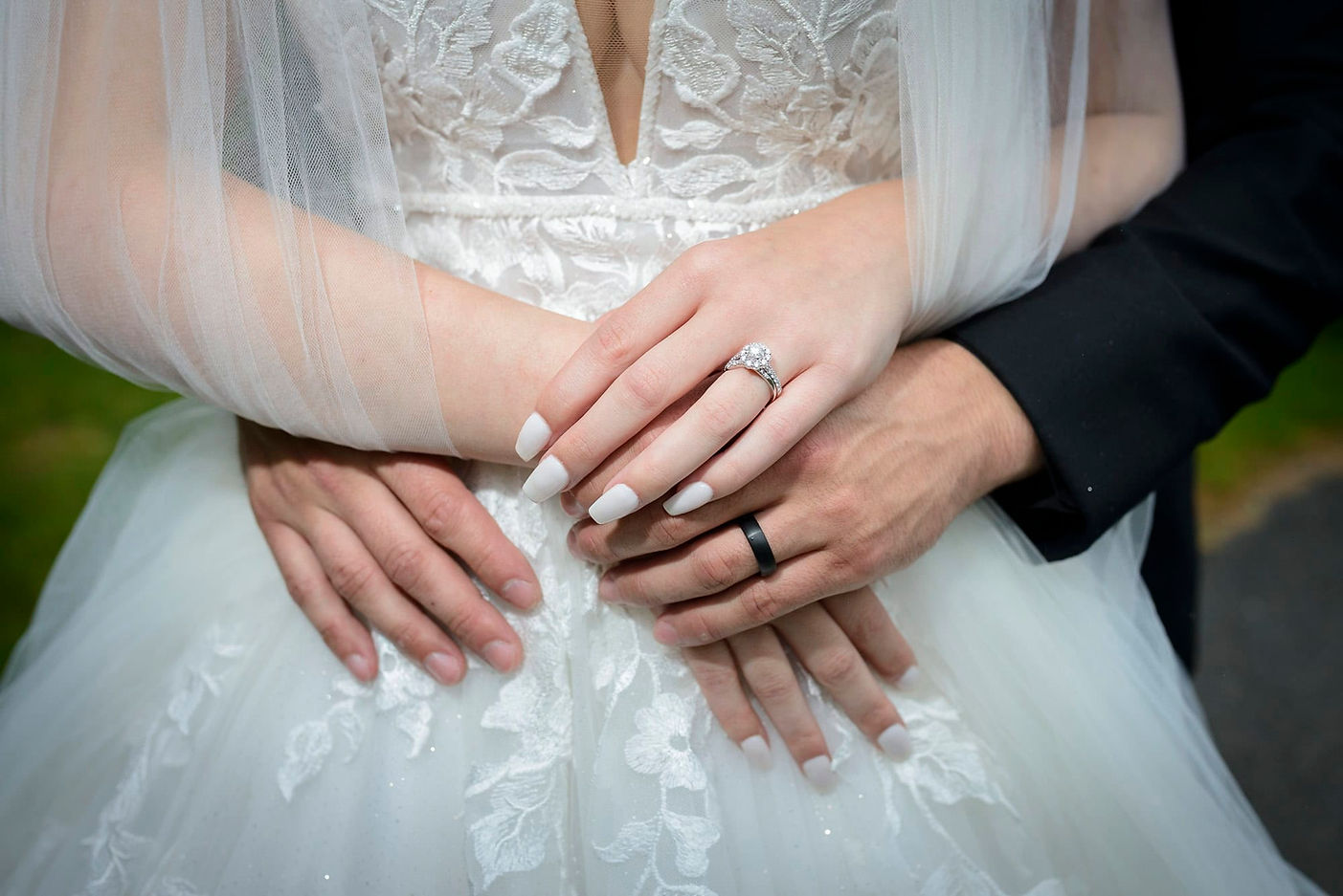 closeup-of-bride-and-grooms-hands.jpg