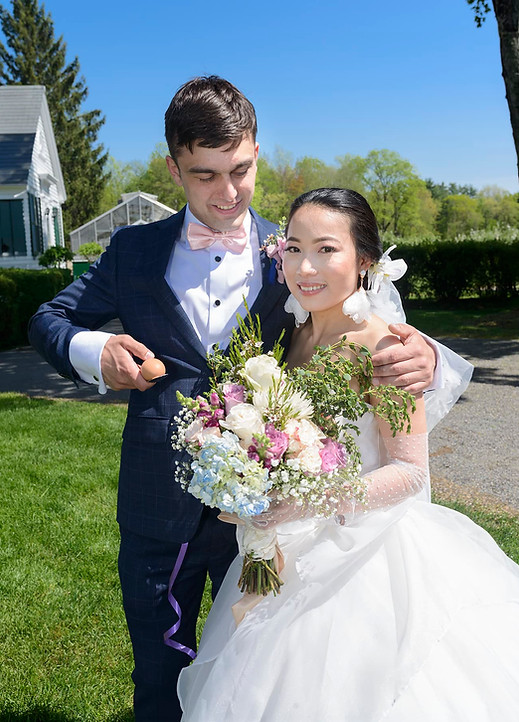 tall-wedding-portrait-with-groom-holding-egg.jpg