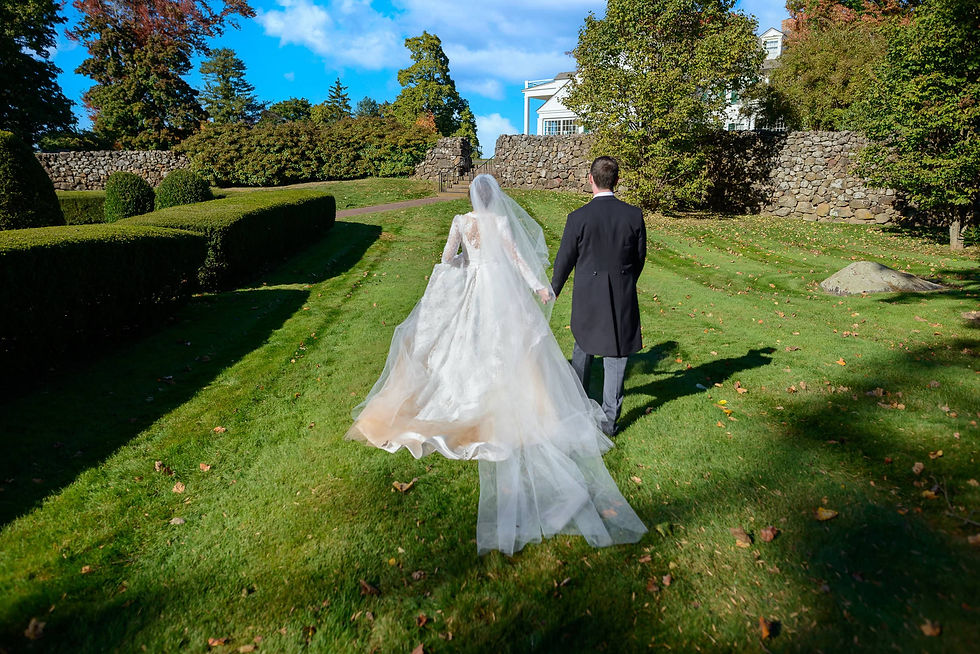 newlyweds-walking-through-a-lush-green-garden-ron-richman-photography.jpg