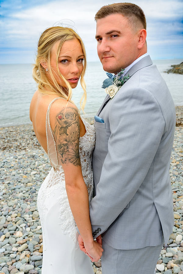ocean-beach-wedding-couple-portrait-looking-back.jpg