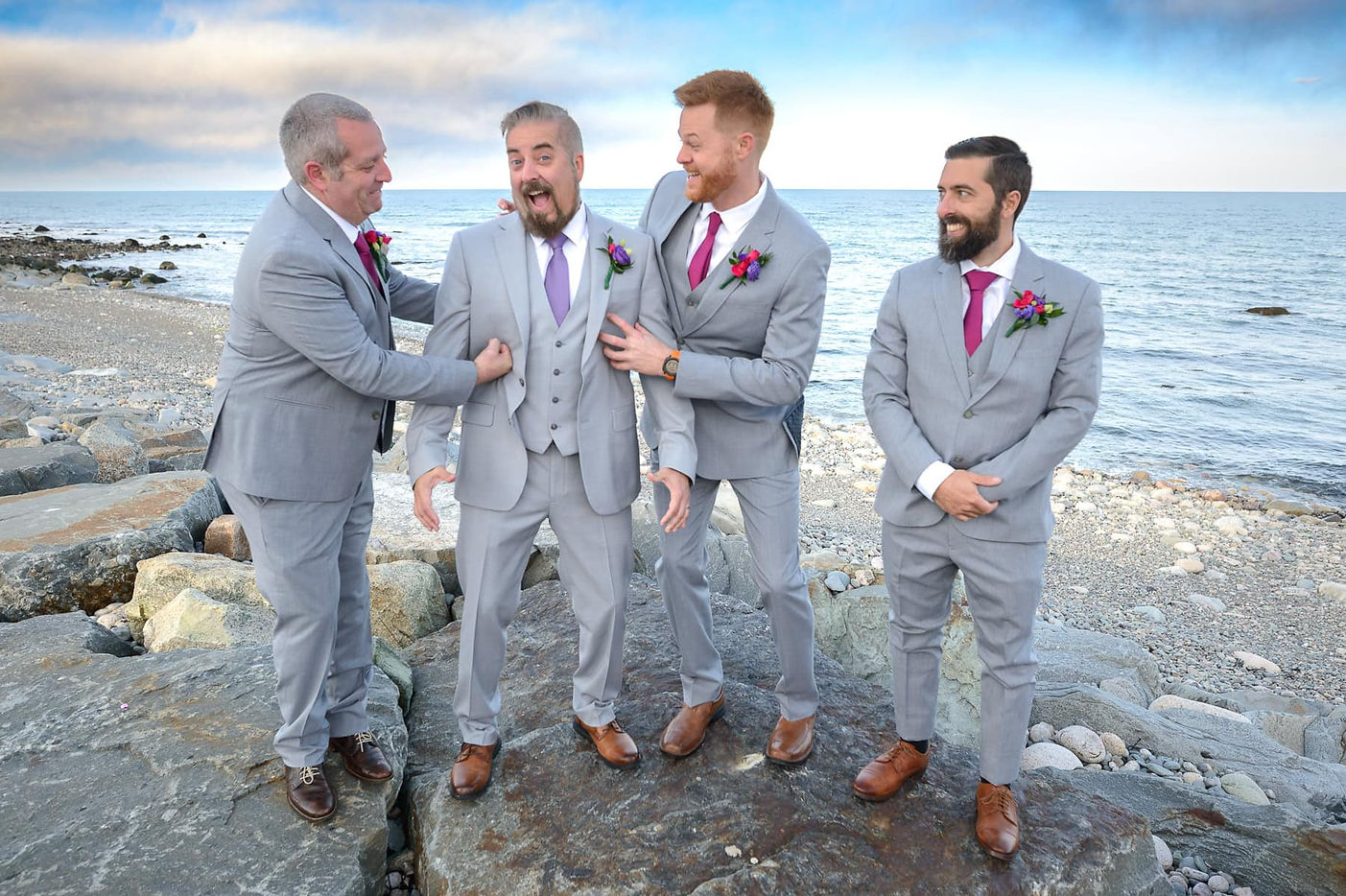 groom-and-groomsmen-portrait-on-the-rocks.jpg