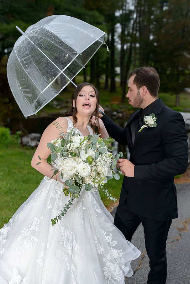 portrait-bride-groom-mugging-by-pond-in-drizzle.jpg