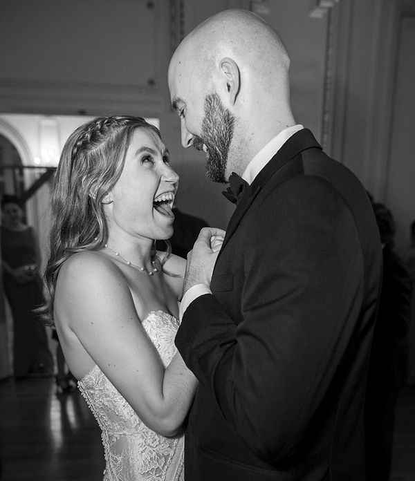 Bride and groom share a joyful first dance at Tupper Manor in Beverly, photographed by Boston wedding photographer Ron Richman.