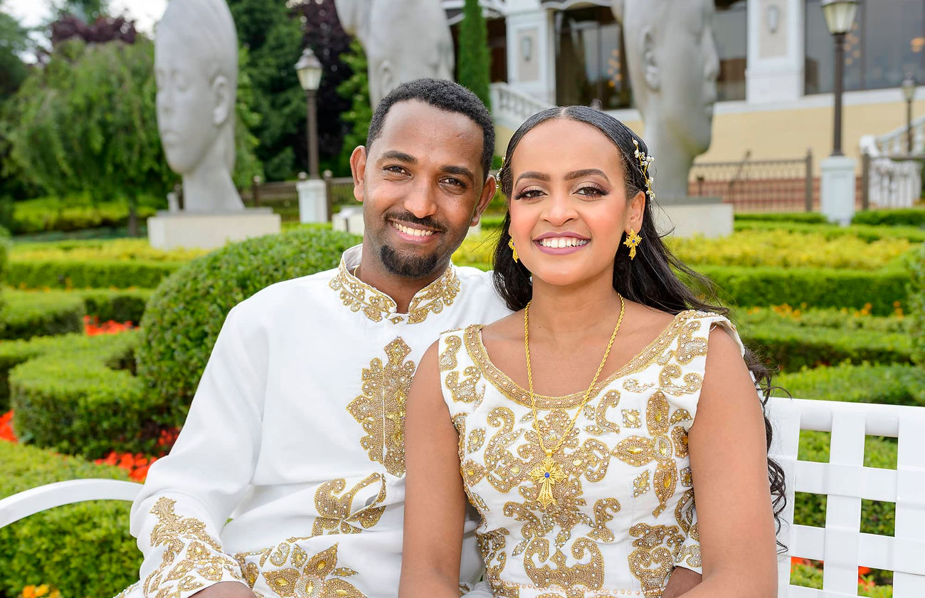 ethiopian-bride-groom-bench-portrait-smiling.jpg