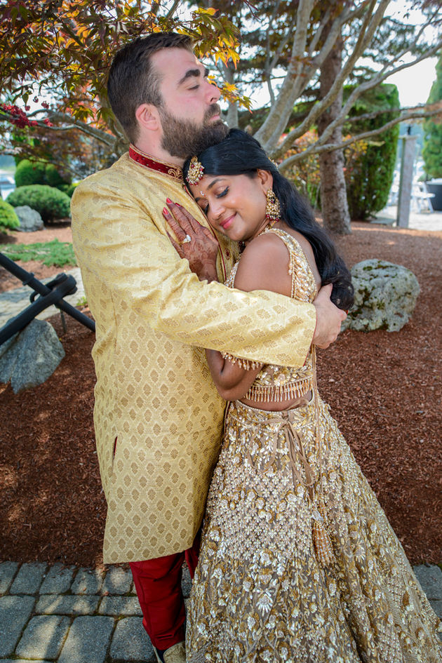 Bride and groom share a joyful, romantic moment during their South Asian Valima celebration at Avenir in Walpole, Massachusetts, with the bride smiling lovingly at her groom.