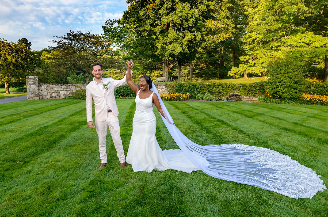 newlyweds-hands-in-the-air-in-celebration.jpg