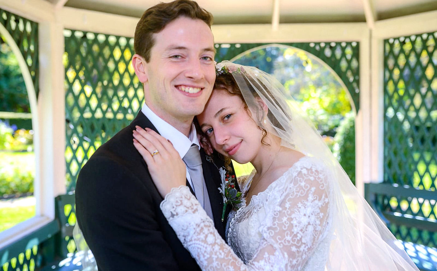 bride-and-groom-posing-in-a-gazebo-beaut