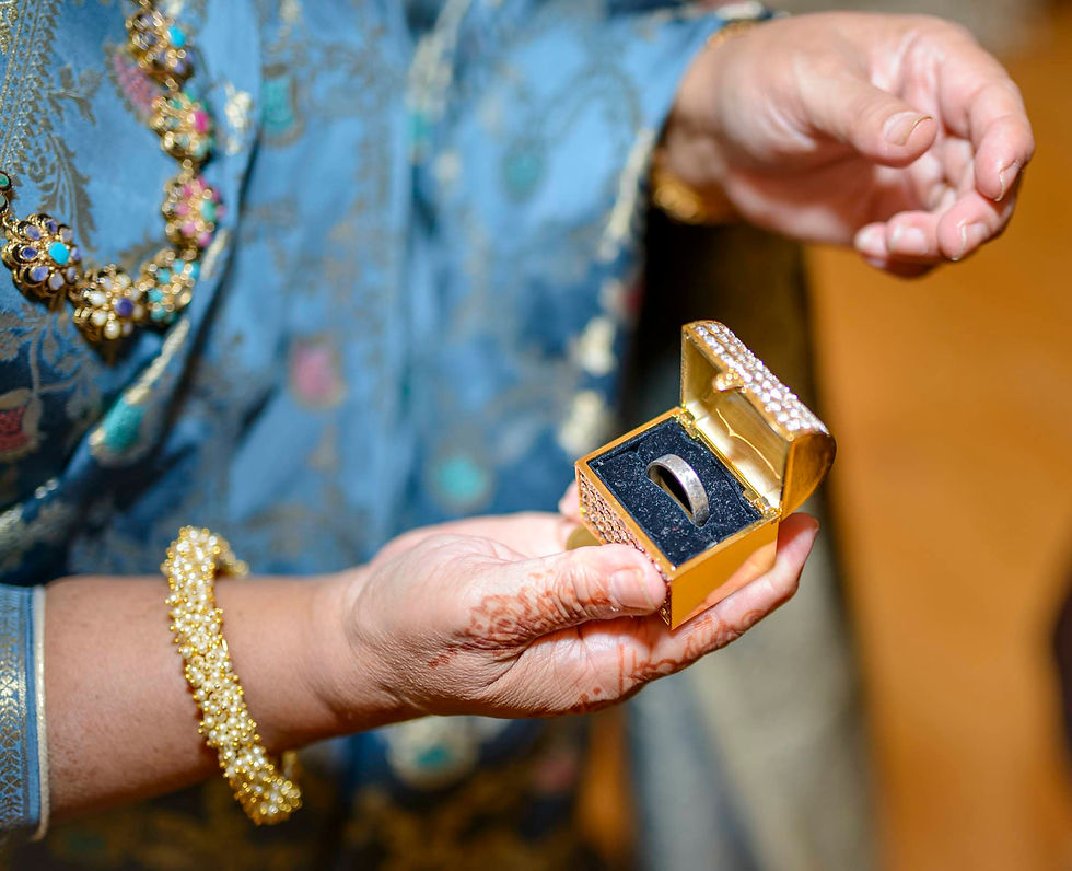 mother-showing-wedding-ring-in-golden-jewlery-box.jpg