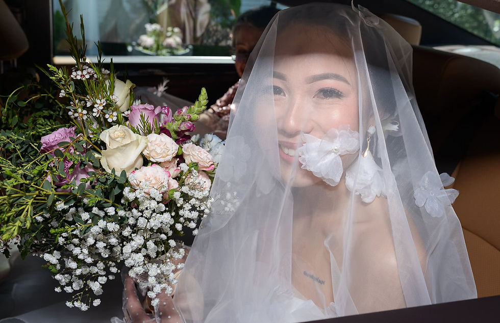 bride-arrives-in-a car-photographed-through-car-window.jpg