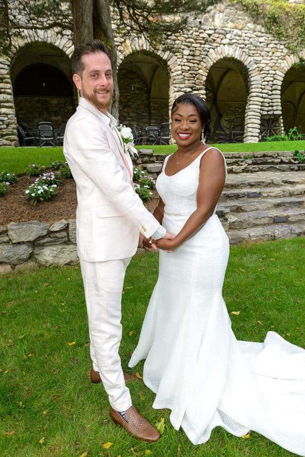 Bride and groom holding hands after their first look