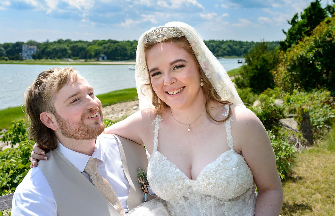 wedding-couple-on-a-bench-near-the-ocean.JPG