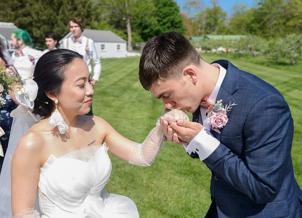 groom-kissing-brides-hand.jpg