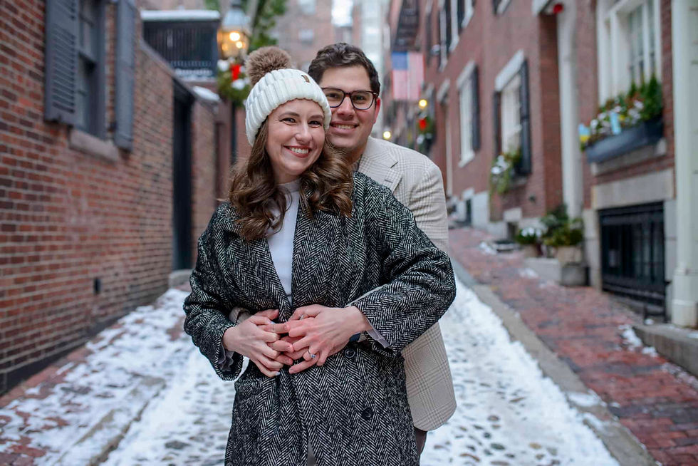 engaged-couple-standing-on-aarorn-street-in-boston-in-the-winter.jpg