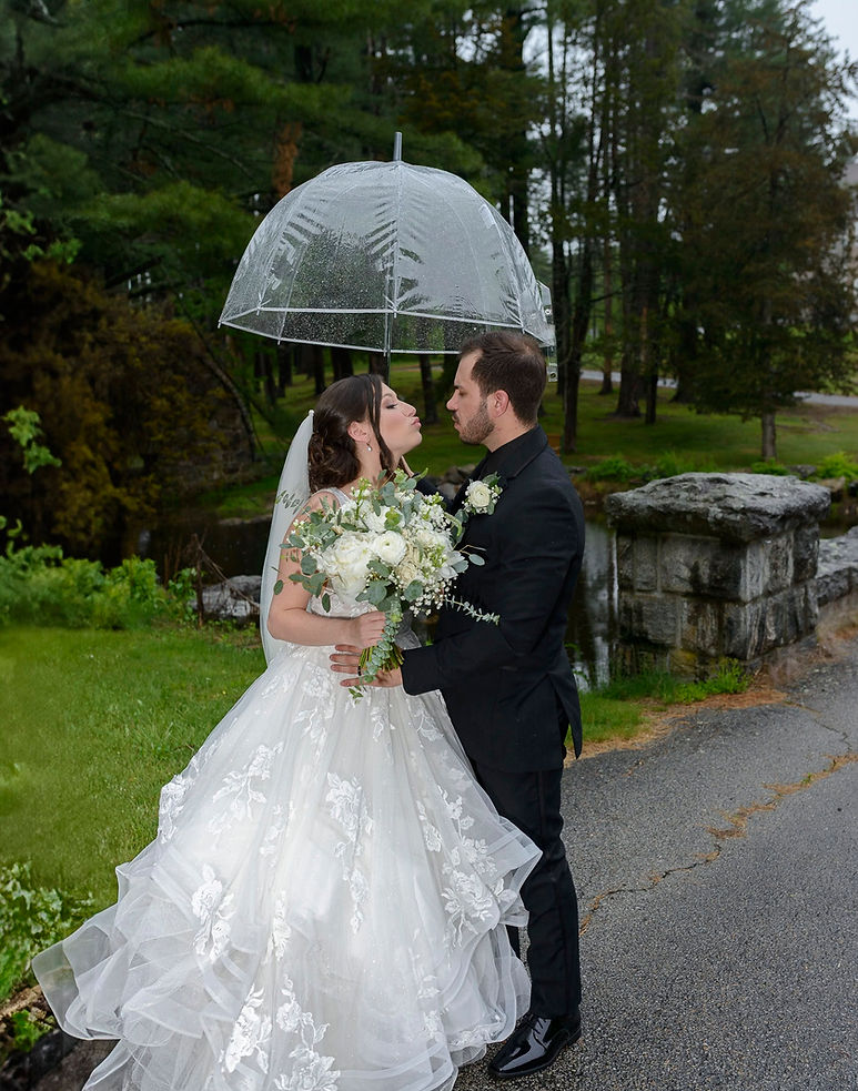 perfect-portrait-bride-groom-by-pond-blowing-kisses.jpg